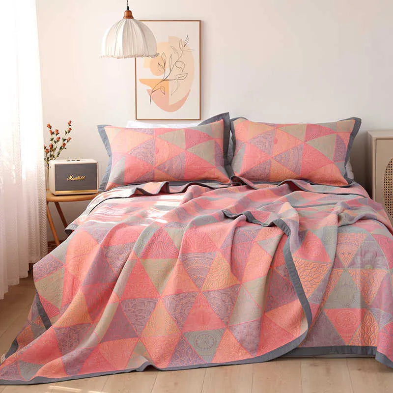 Cotton gauze three-piece bedding set with botanical flower pattern showing blanket and two matching pillowcases