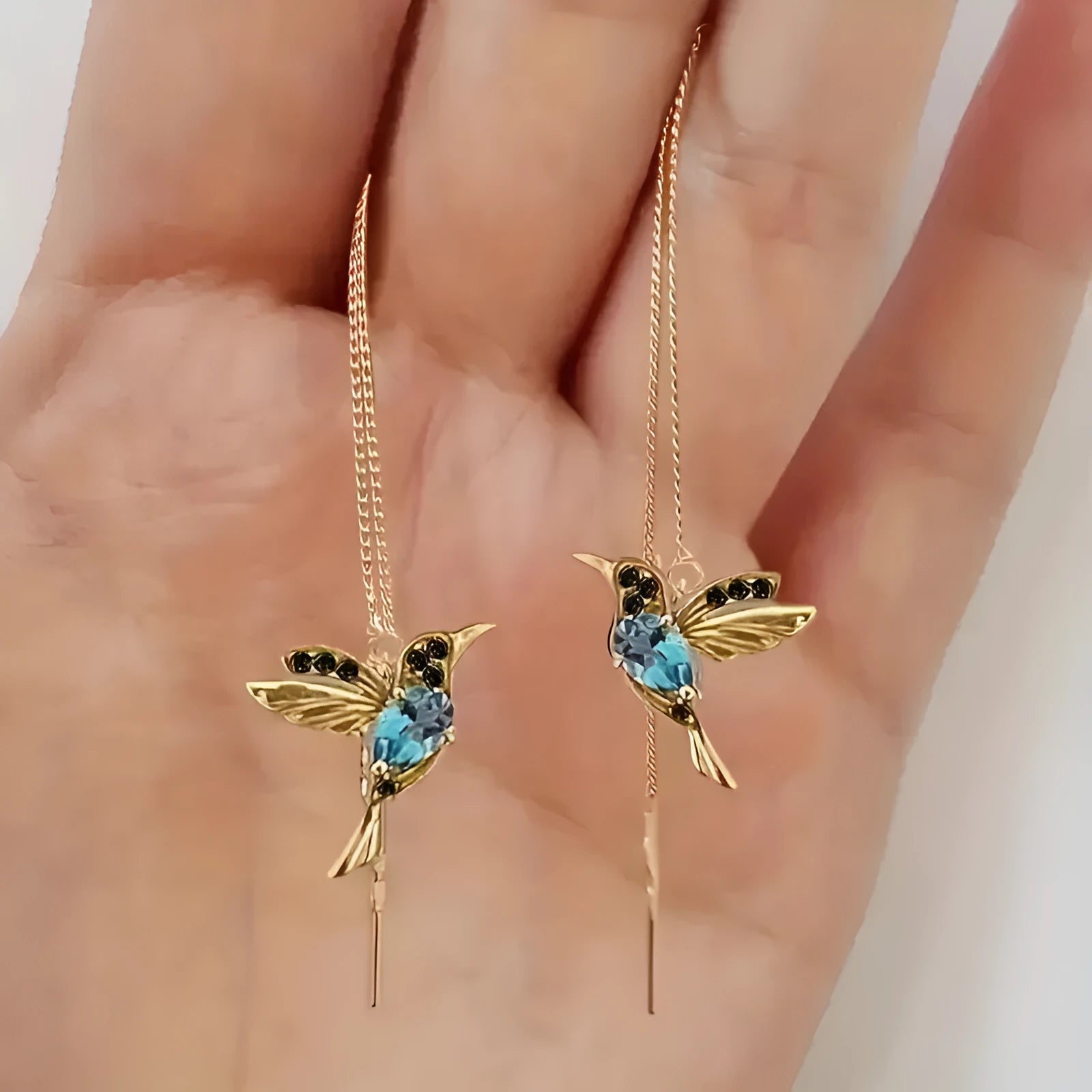 Long hanging earrings with bird decoration featuring mixed zirconium wings on alloy chains