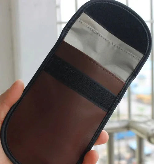 Black microfiber RFID-blocking Faraday bag for car key fobs and credit cards.