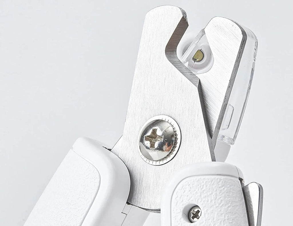 White LED pet nail clippers with transparent guard and triangular steel blade for dogs and cats