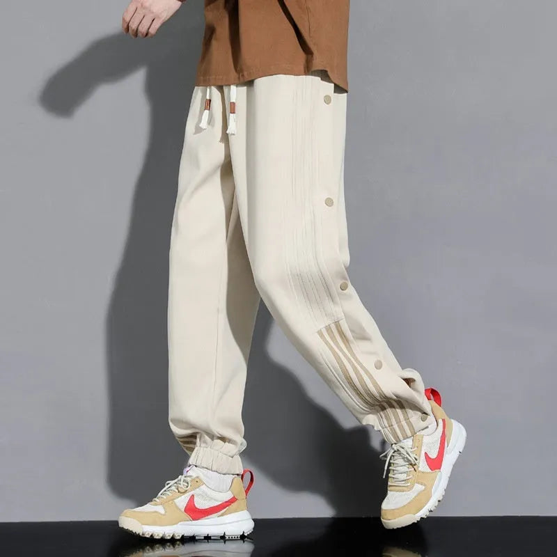 Men's loose cotton blend sweatpants with ankle-tied cuffs in black colour