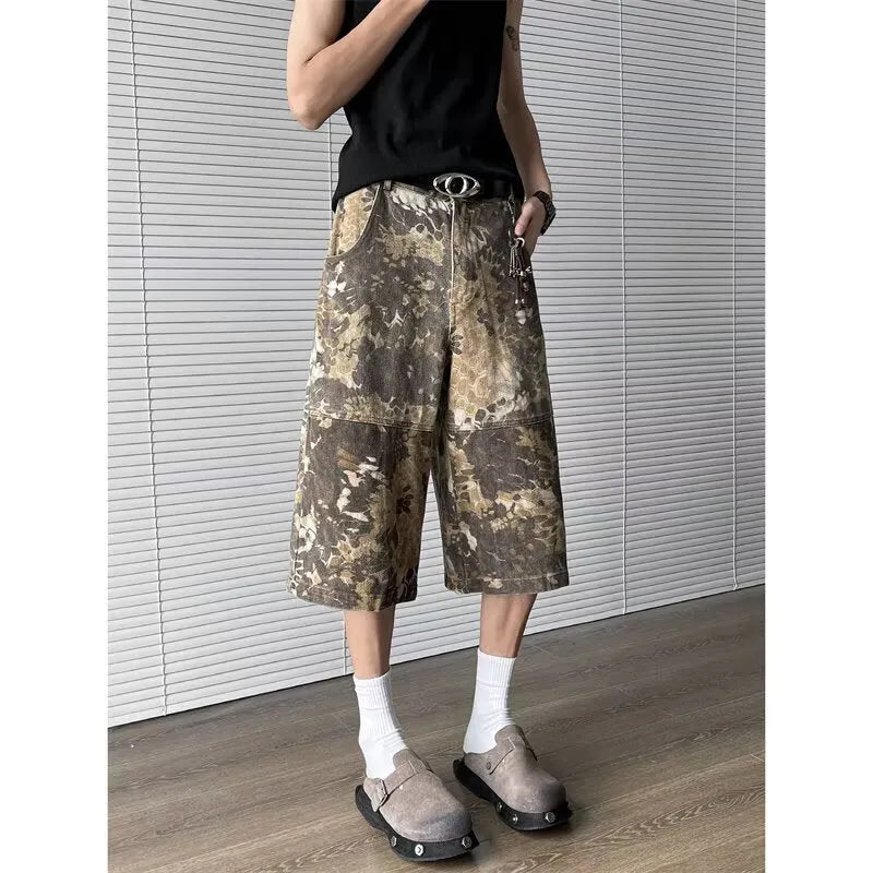 Yellow snake pattern camouflage cropped jeans showing detailed tooling print and denim construction