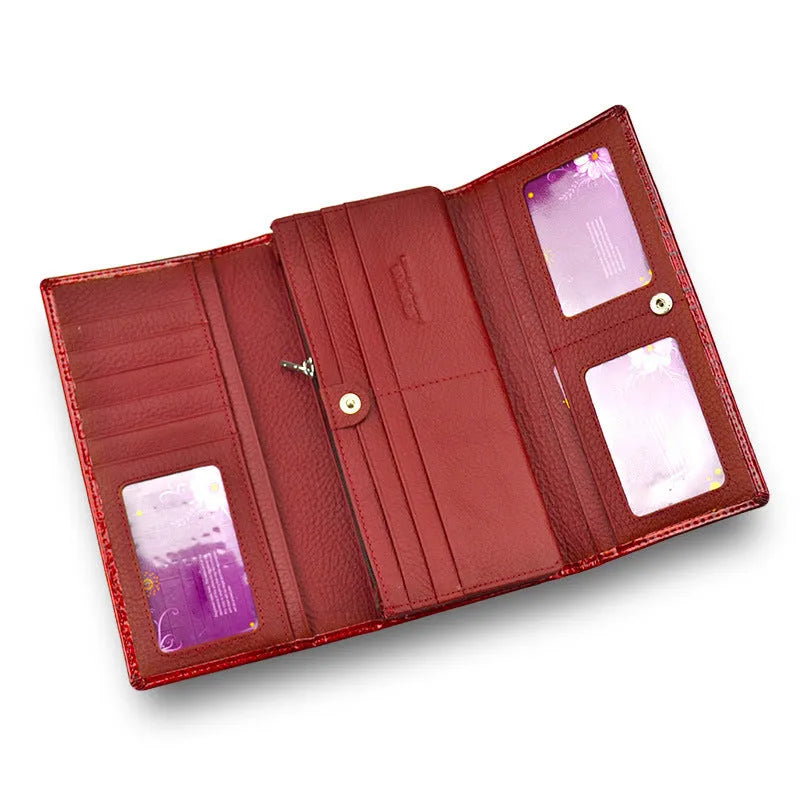 Women's patent leather coin purse with crocodile pattern in red colour showing pigskin lining interior