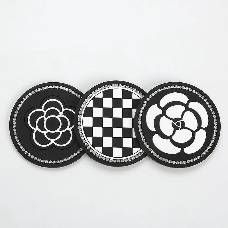 Black and white checkerboard PVC non-slip car water cup mat on a cup holder