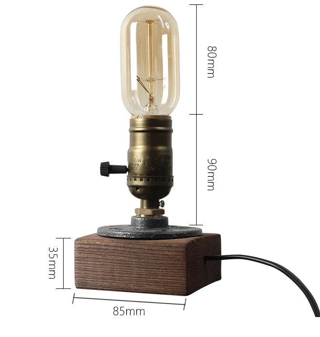 Small wood and iron water pipe style table lamp on a table