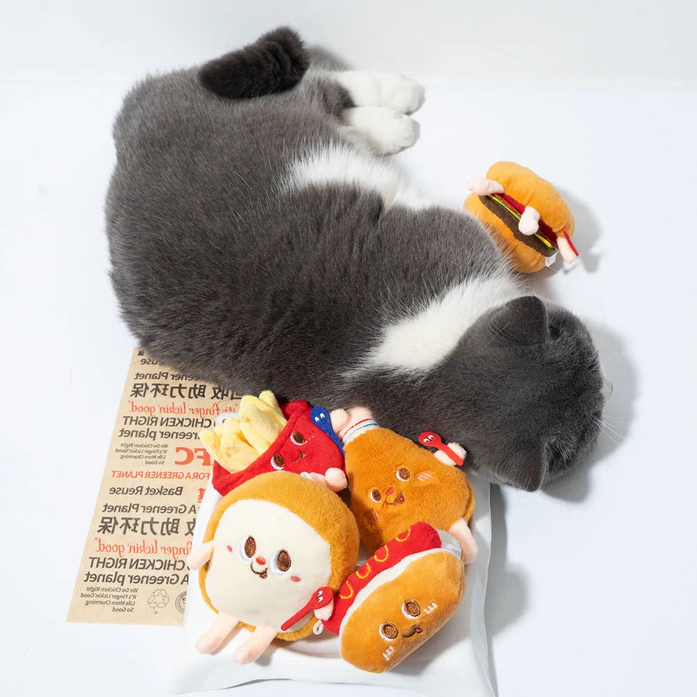 Cat mint teething toy shaped like a hamburger and chicken leg, made from soft plush fabric, on a light background.