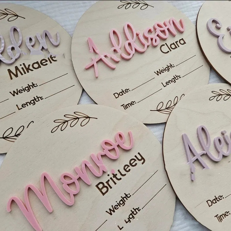 Square wooden baby birth information plaque with engraved details on a plywood base.