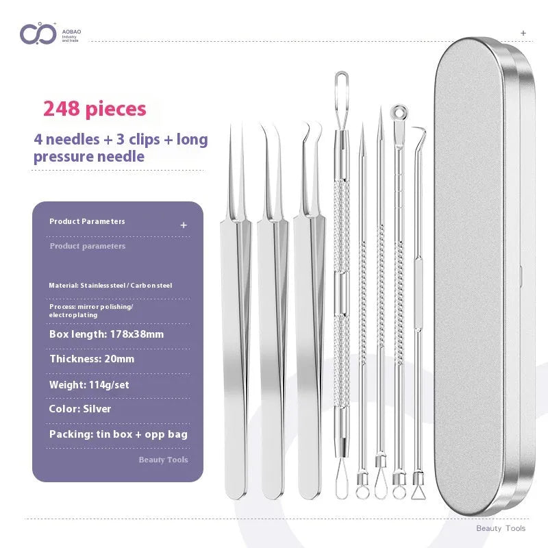 Four silver metal acne needles with fine pointed tips laid out on a surface.