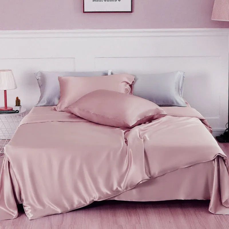 Silk double-sided duvet cover showing reversible design in solid colours including lotus pink, pea green, and bright brown