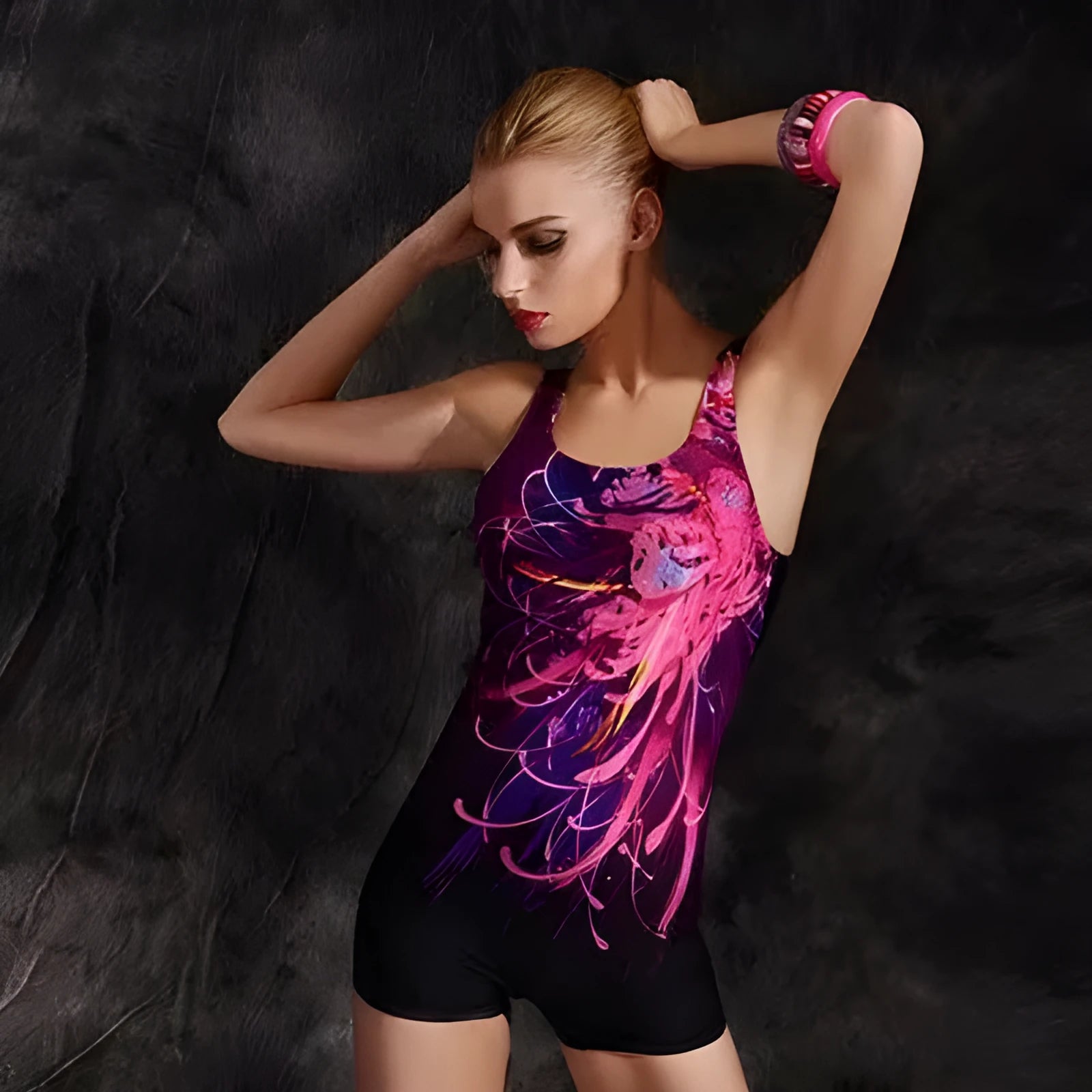 Black and blue women's sleeveless one-piece swimsuit made from quick-drying polyester fabric.