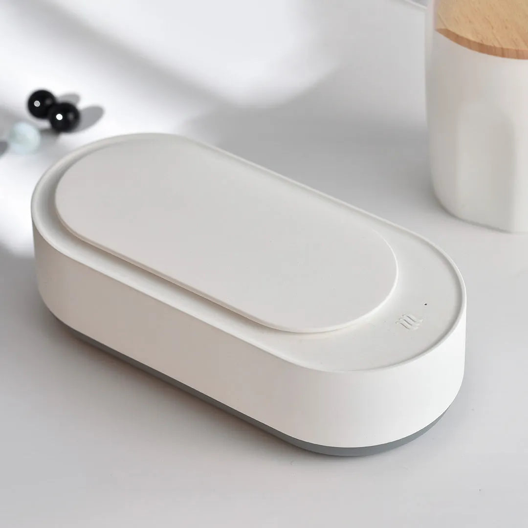 White portable ultrasonic cleaning machine with touch button and stainless steel tank.