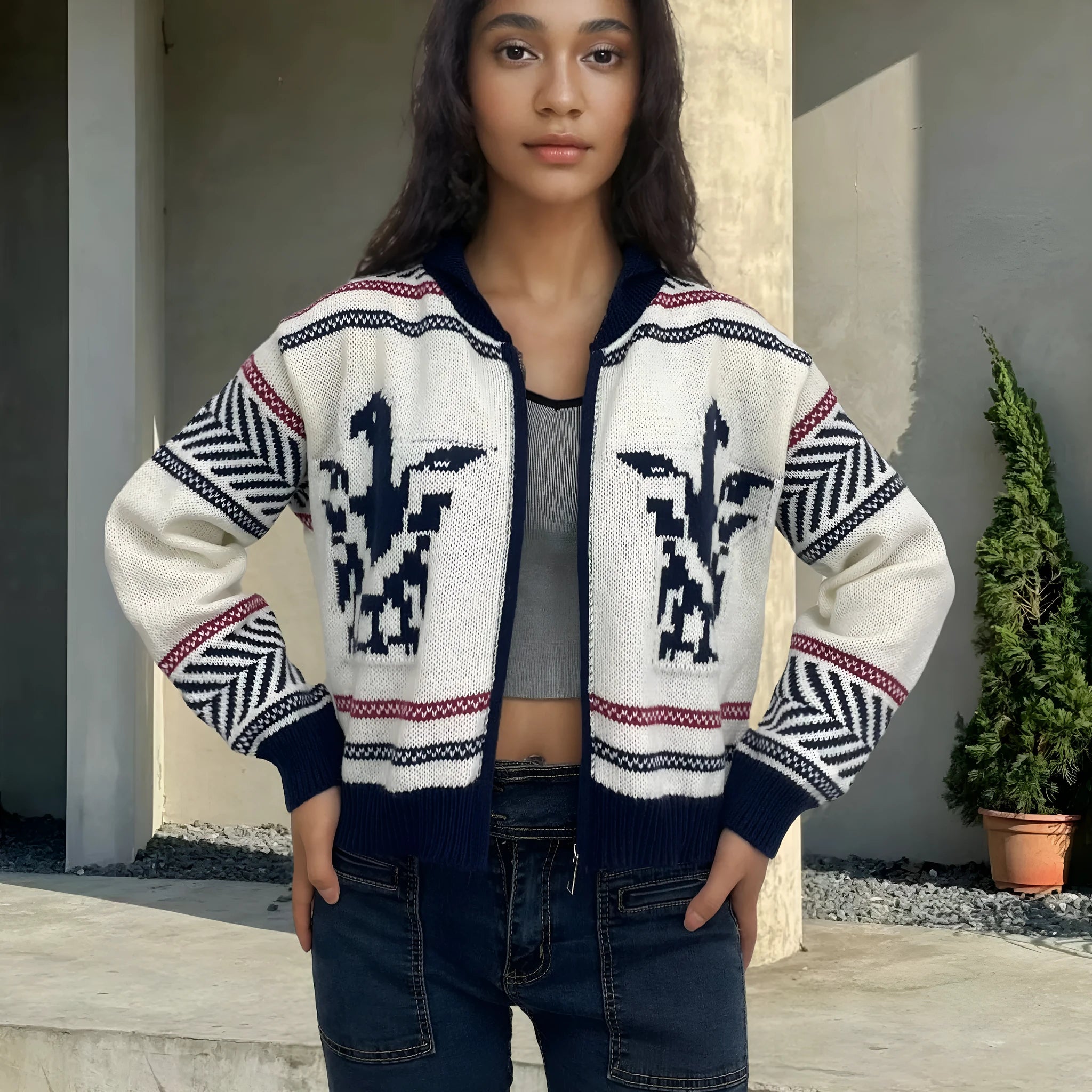 White women's wool zip cardigan with a jacquard contrast colour pattern on the lapel.