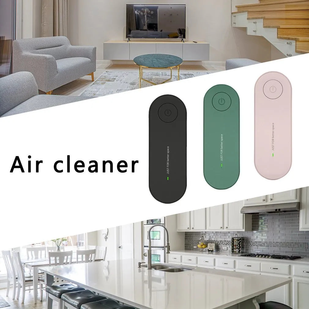 Small negative ion air purifier in black, plugged into a wall socket, with a room in the background