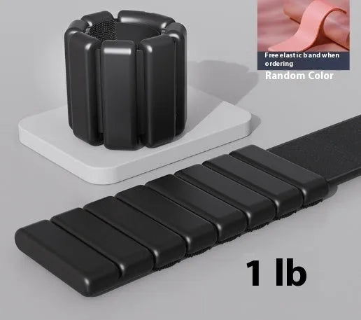 Adjustable silicone wrist weight bracelet with Velcro fastening in black, blue, gray, or pink