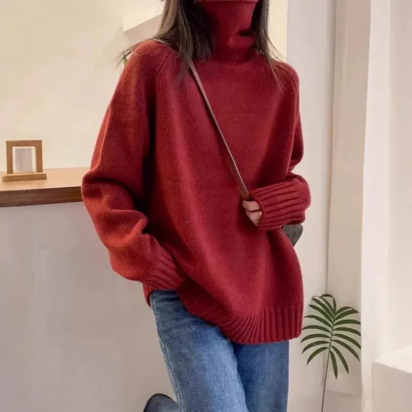 Women's loose grey turtleneck sweater with a thick knit and textured curling pile collar.