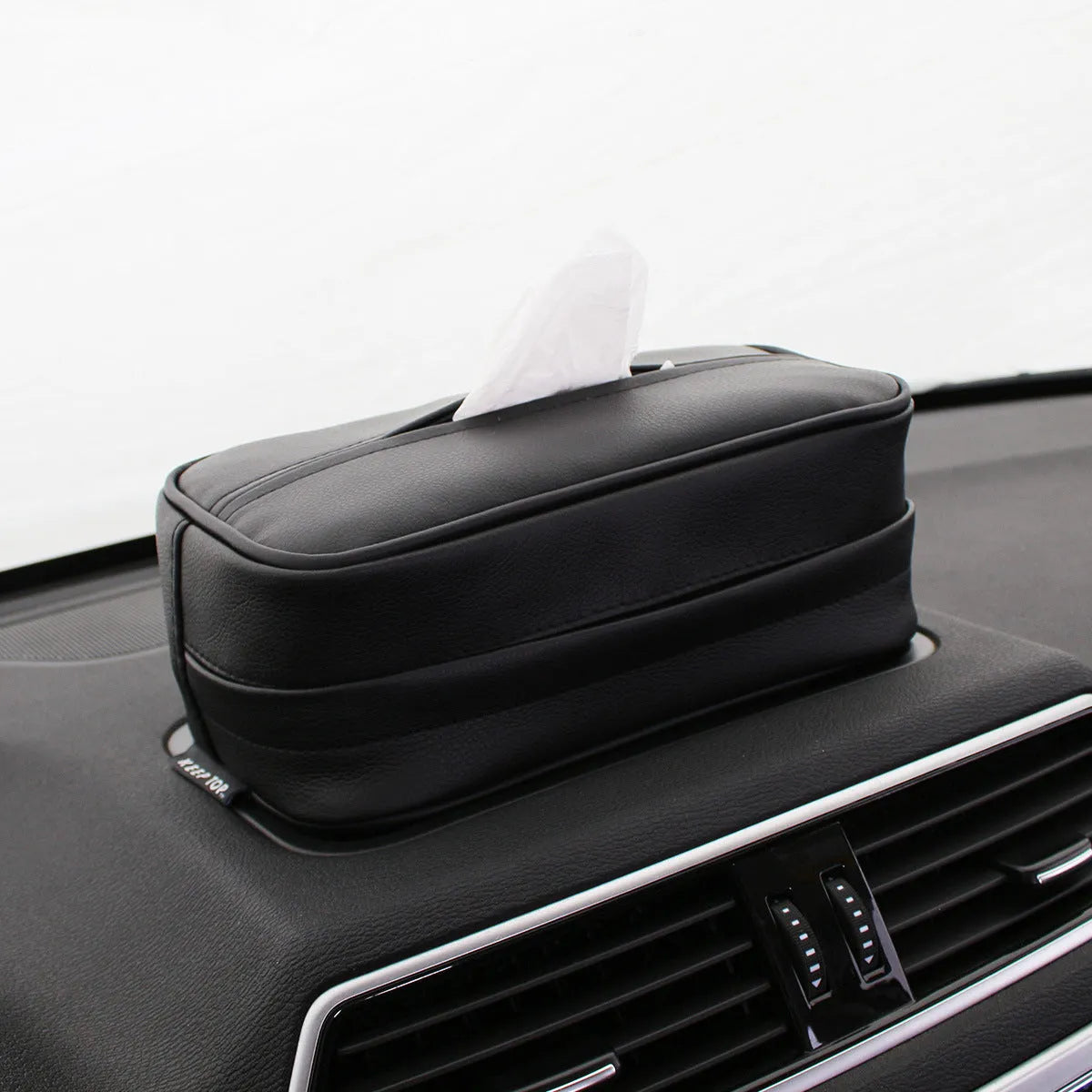 Black leather car hanging storage box with PU strap measuring 23x13x9cm