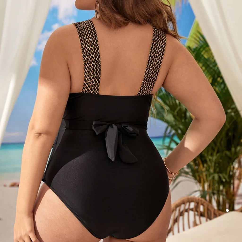 Women's black sleeveless one-piece swimsuit with chest support on a mannequin.