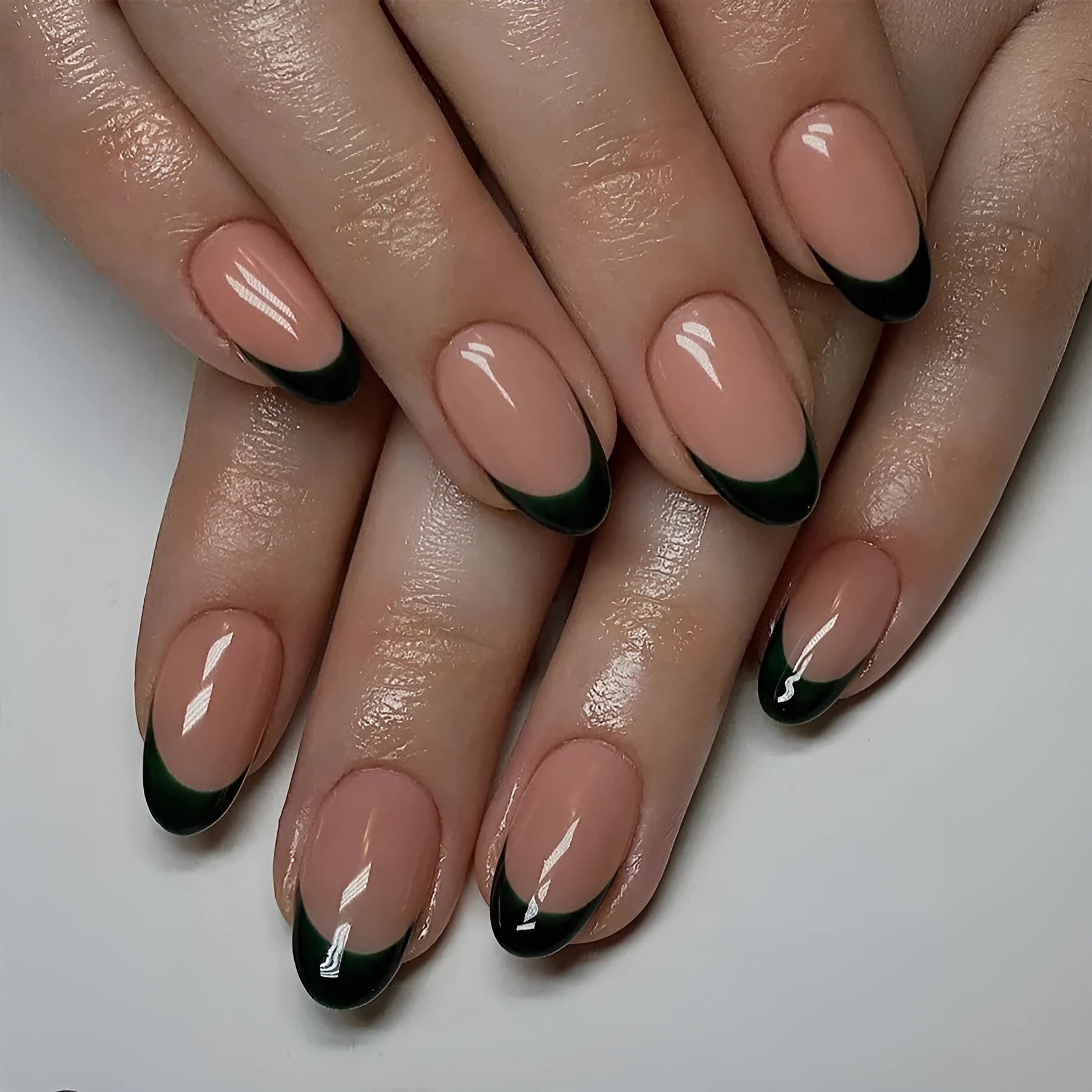 Simple black French style wear manicure 24 pieces short almond shape on neutral background
