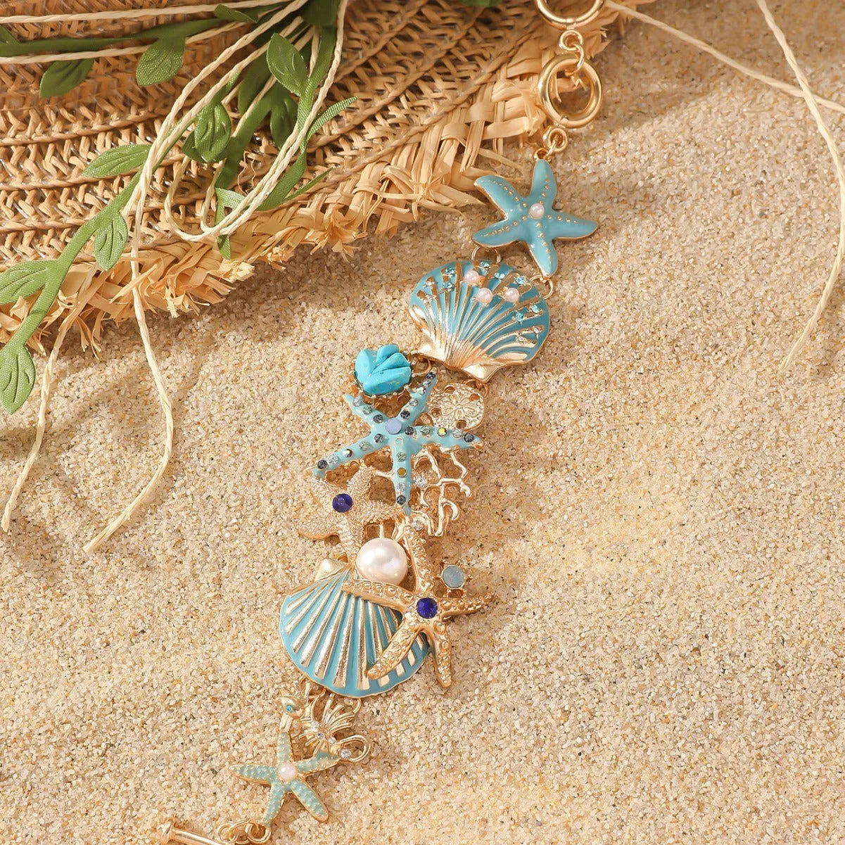 Women's alloy bracelet with a boat anchor charm, starfish, and rhinestones in turquoise, red, or blue.