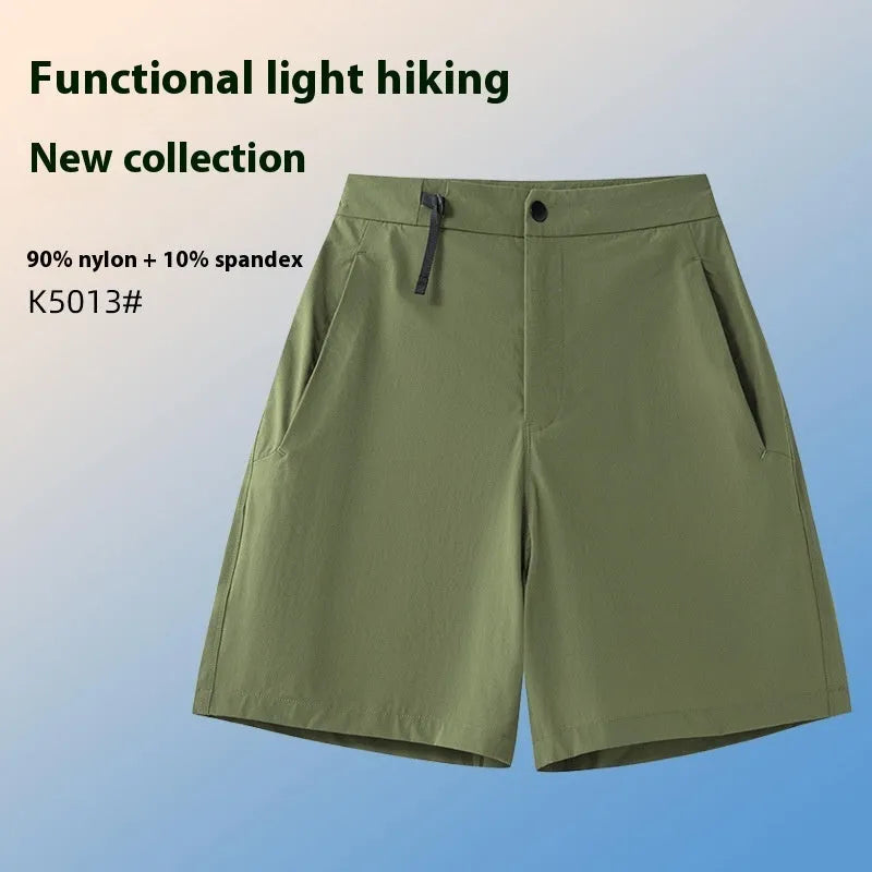 Men's solid colour quick-dry sports shorts with elastic waistband shown in Army Green