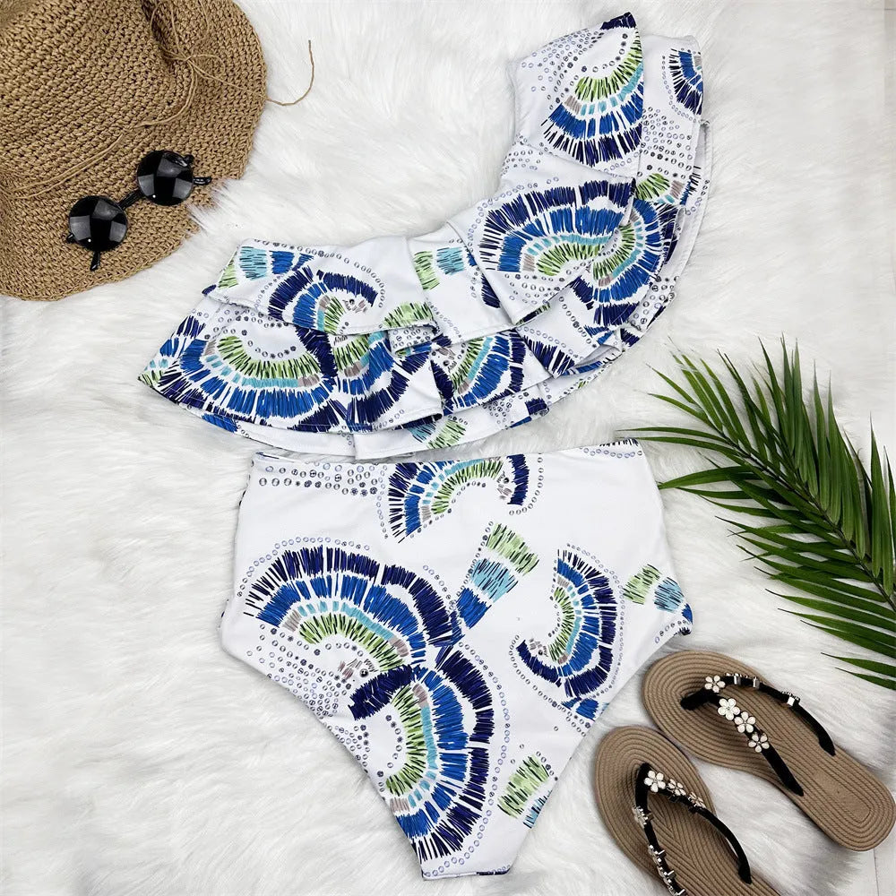White women's one-shoulder swimsuit with lotus leaf design and high leg split