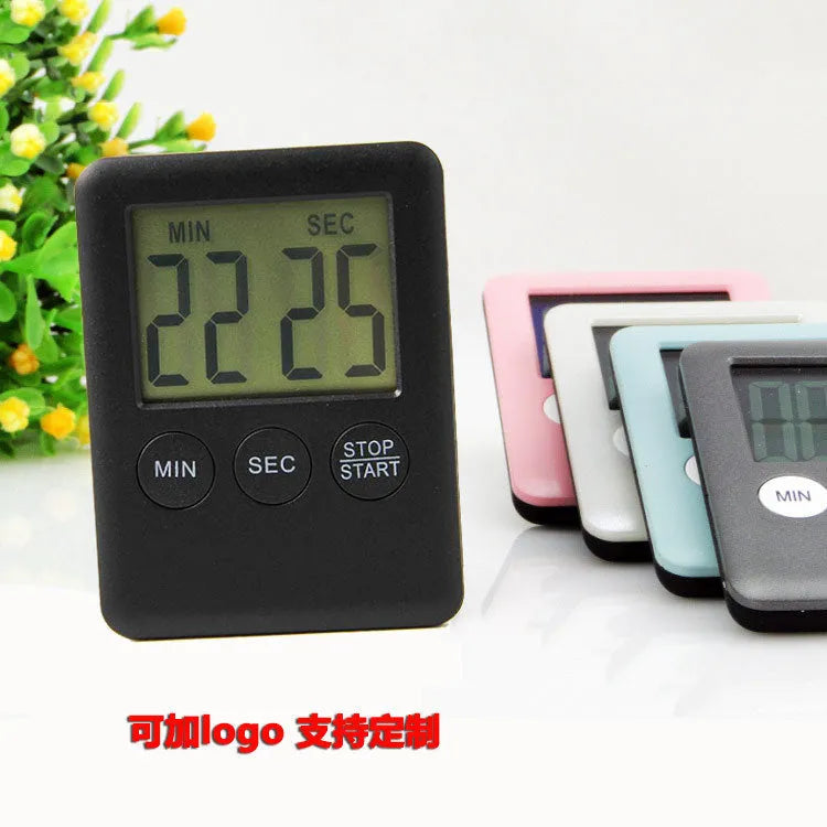 Mechanical kitchen timer with magnetic back showing white dial with black numbers