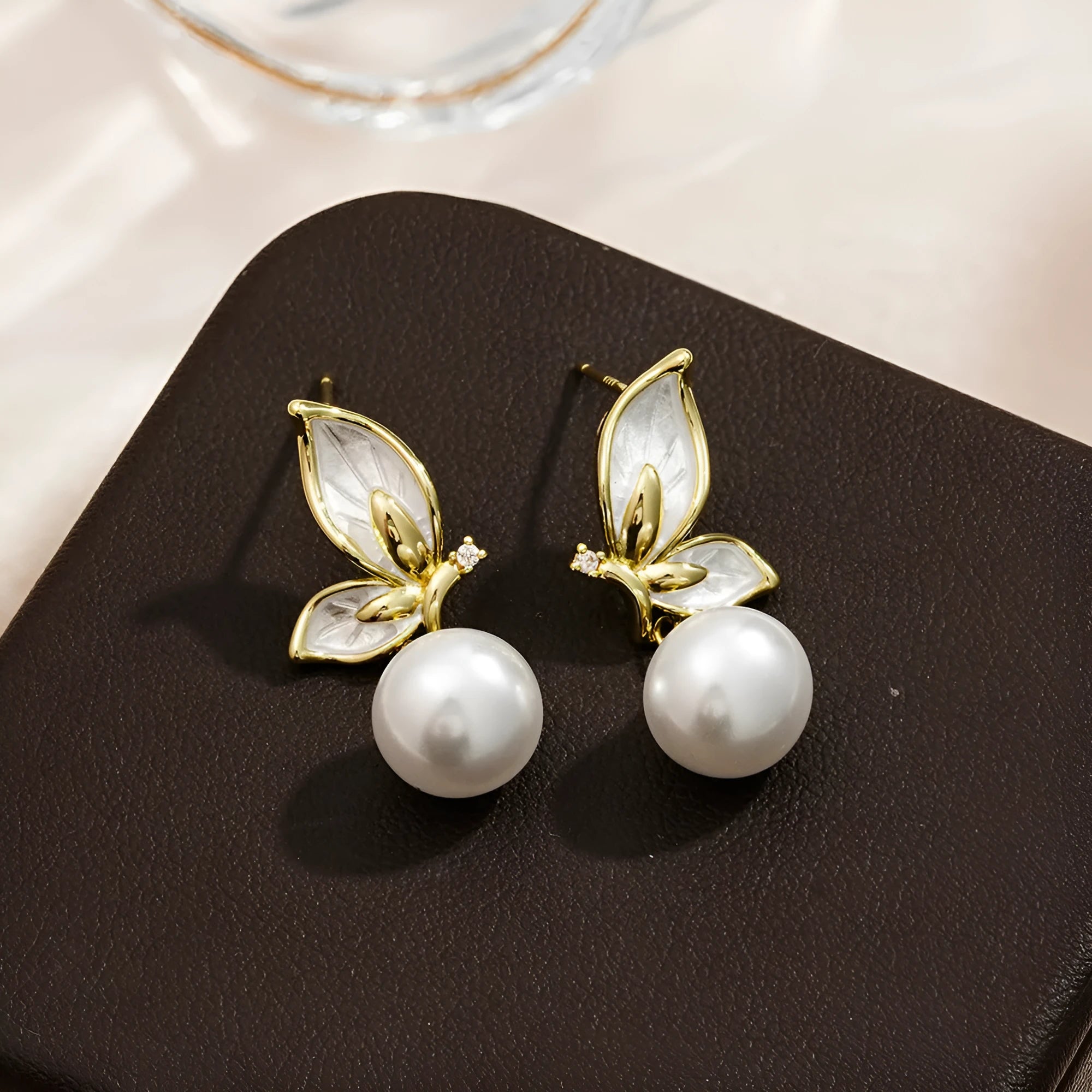 Gold-coloured butterfly earrings with zircon painting detail on copper metal for women
