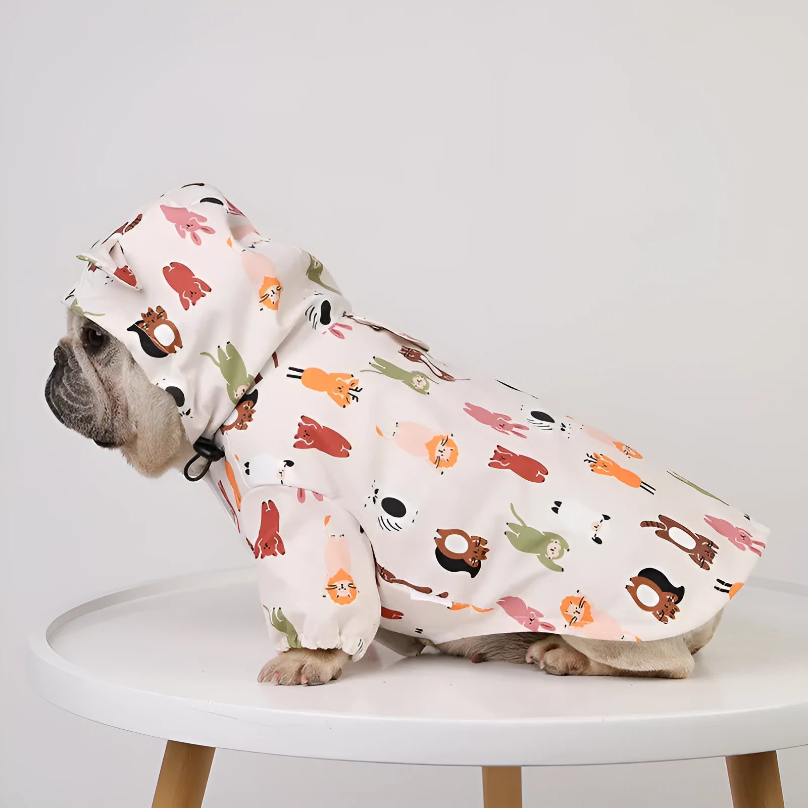 Beige cartoon dog raincoat with cat head design, made from waterproof PU material.
