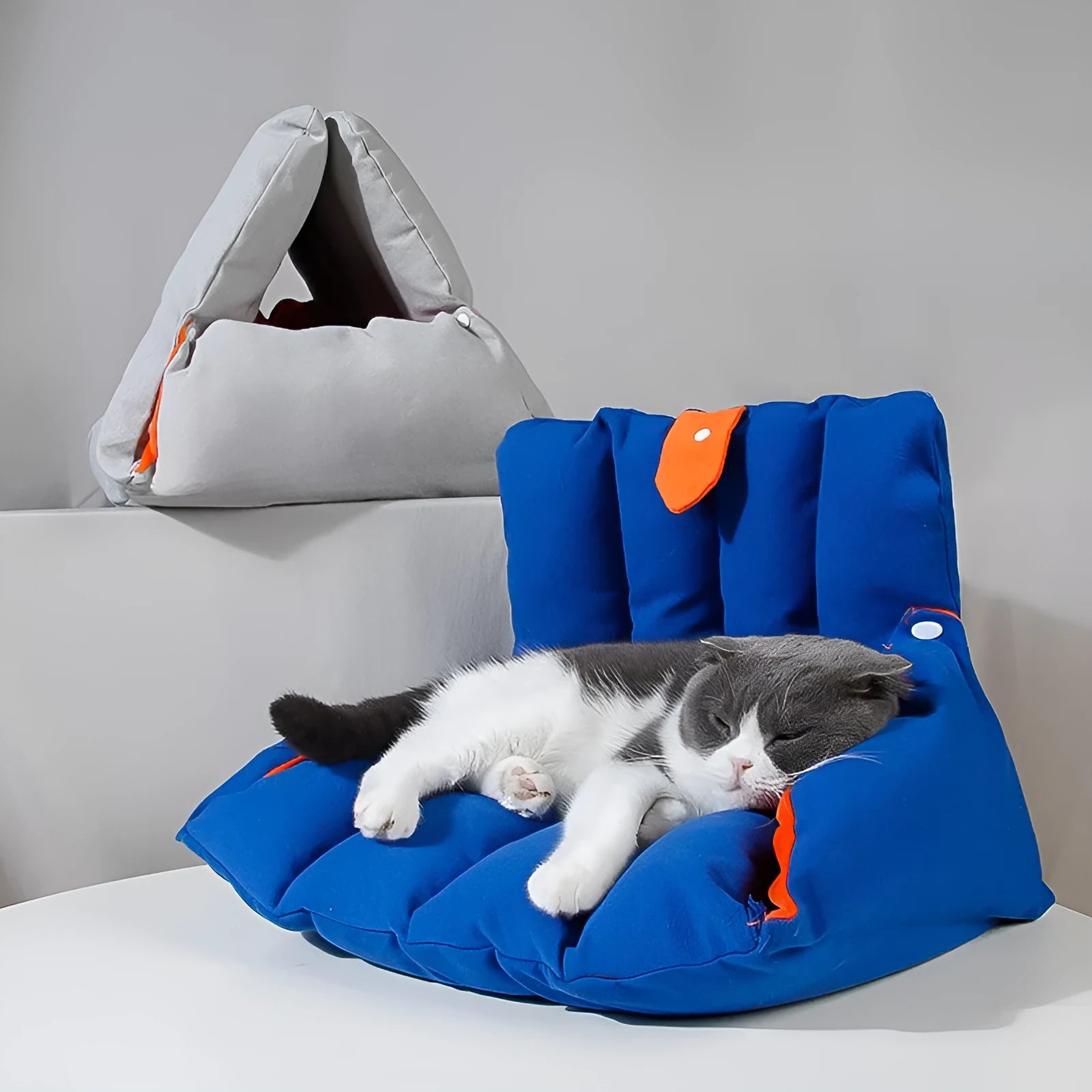 Triangular blue cotton cat nest with drilled holes for deforming, 45x38x38cm, on a wooden floor
