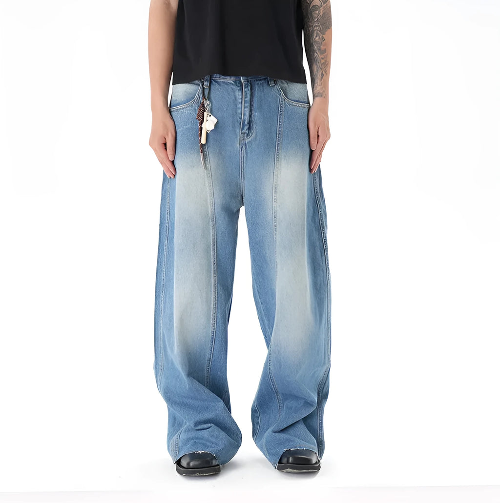 Light blue vintage washed wide leg machete jeans with zip fly on a model