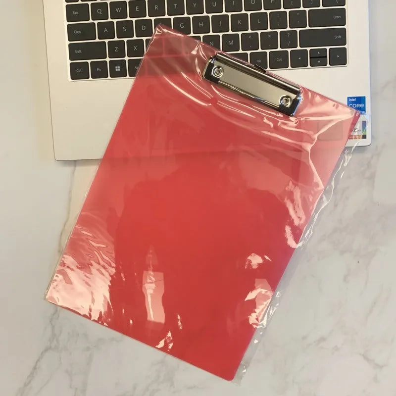 Transparent A4 writing board with metal clip holding papers, available in multiple colours
