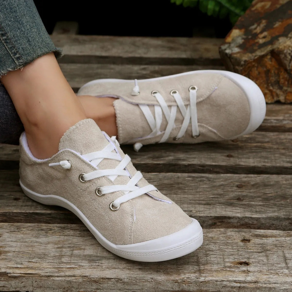 Women's creamy-white fabric casual sneakers with low-top design and rubber sole