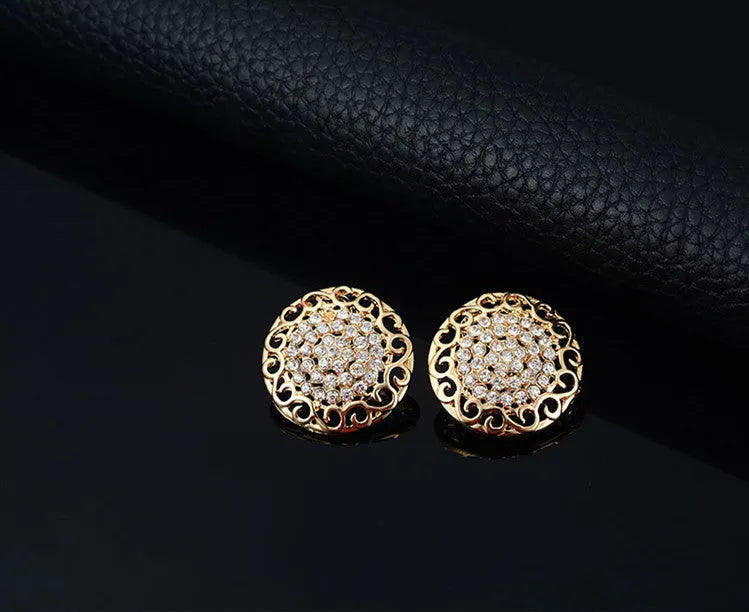 Gold jewellery four piece set with necklace, earrings, ring, and hand accessories featuring alloy and artificial gems