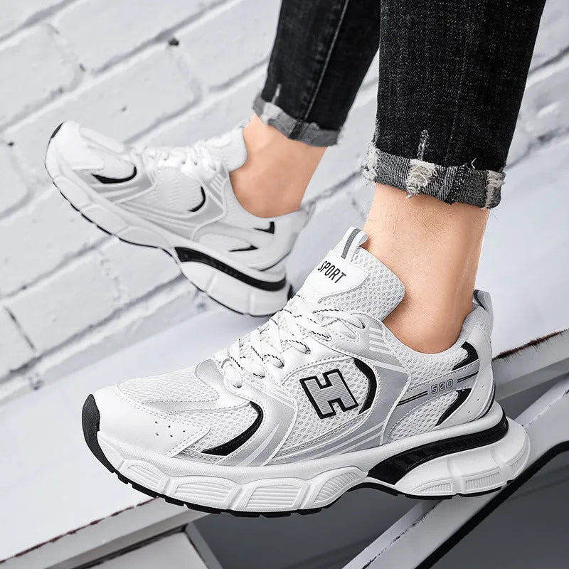 Men's mesh running shoes in black, white and grey, or white orange colours with plastic sole