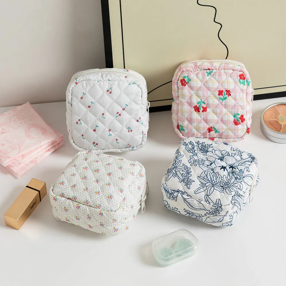 Floral print polyester key storage bag with sewing thread decoration in pink small flower colour.