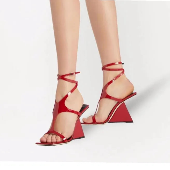 Women's black high heel sandals with 9.5cm heel and button fastening on a square toe.