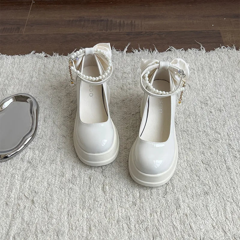Women's beige chunky heel Mary Jane shoes with round toe and shallow vamp on a white background