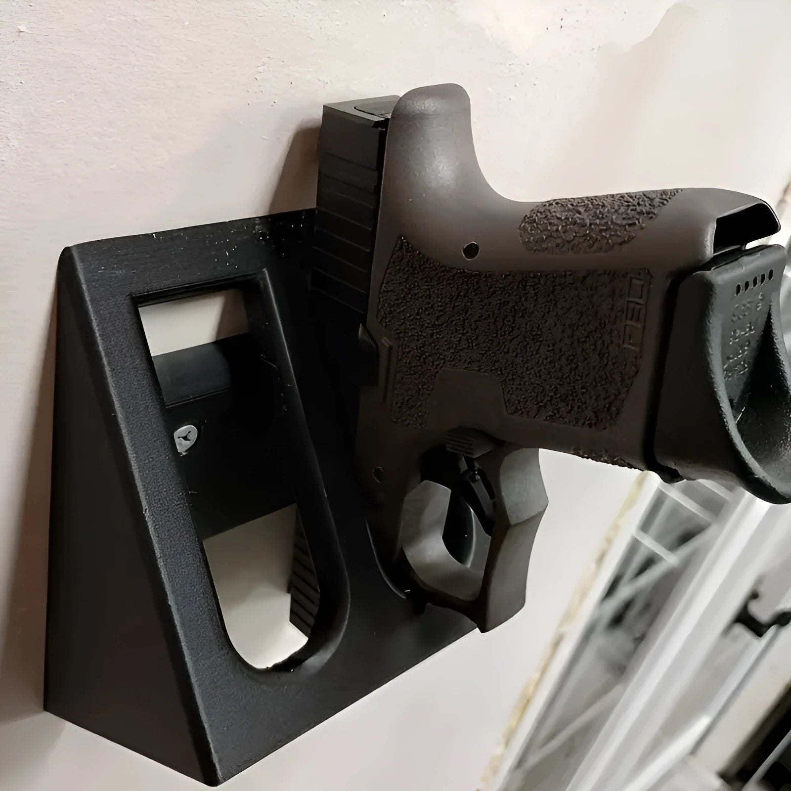 Black plastic punk-style pistol stand for displaying decorative firearms