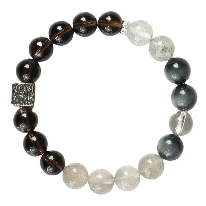 Polished crystal bracelet in khaki with 10mm geometric beads on a neutral background