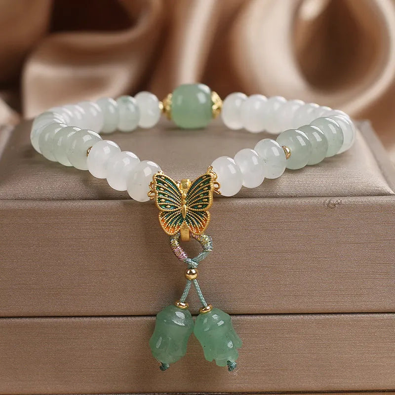 Tian Shan Cui green crystal abacus beads bracelet with butterfly tassel and pearl rhinestone sequin details, 17cm
