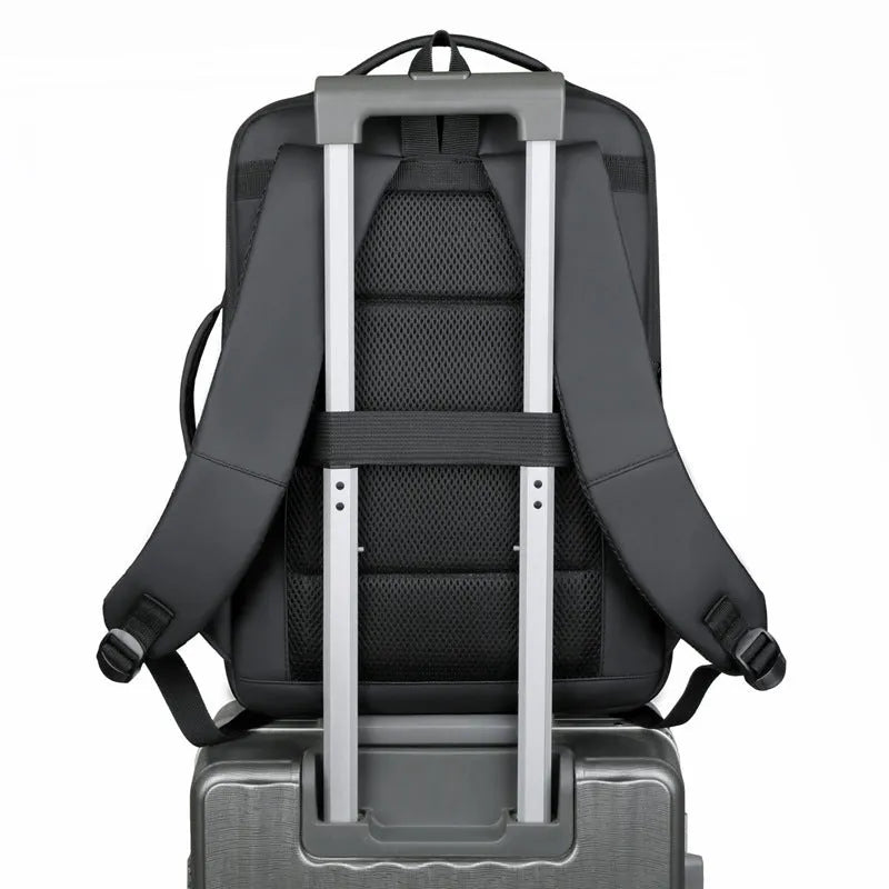 Black waterproof Oxford cloth business backpack with curved shoulder strap showing laptop compartment and 20-35L capacity.
