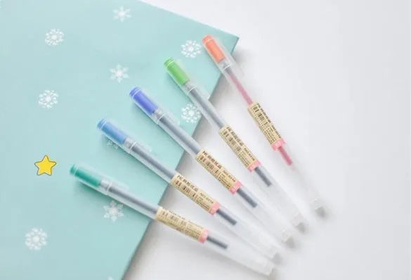 12 Muji 0.5mm gel pens with fine nibs and ink prevention mechanism.