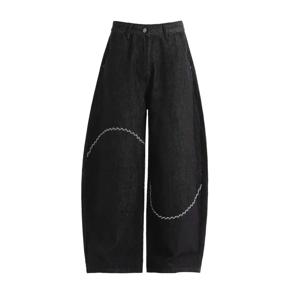 Black Pu Shuai straight-leg denim trousers with a mid waist and zip fly, laid flat.
