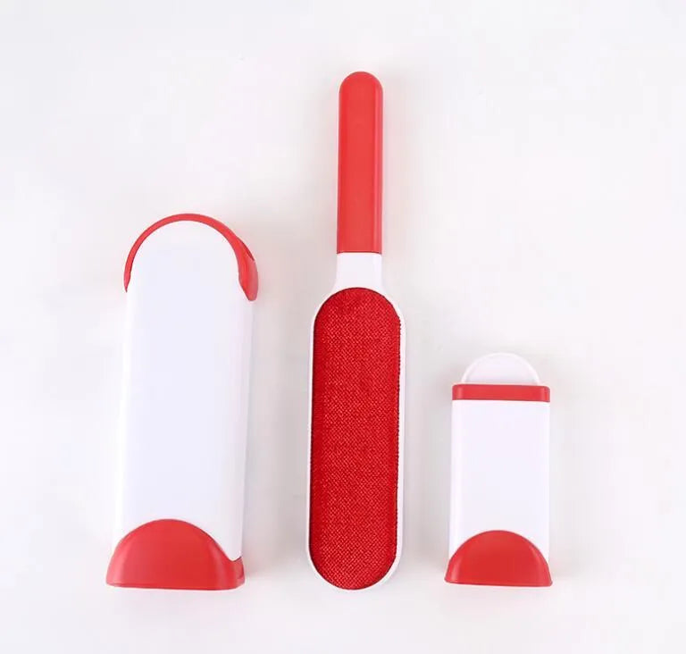 Blue self-cleaning pet hair removal brush for sofas on a grey fabric couch.