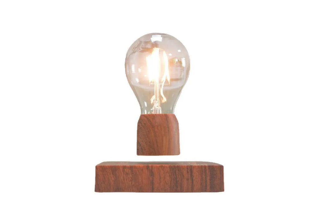 Magnetic levitation floating bulb lamp with ABS glass construction on imitation wood base