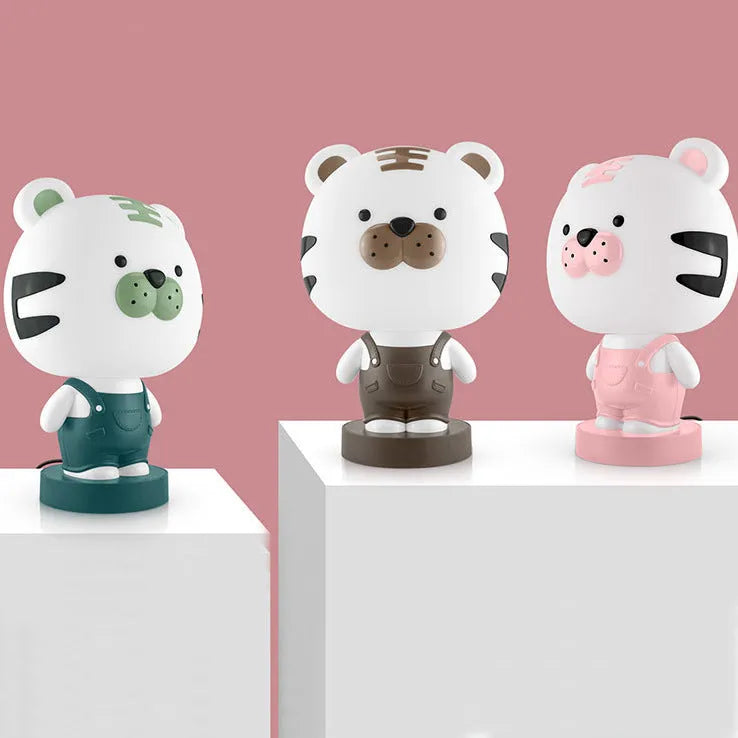 A plastic cartoon animal table lamp in a bear, cattle, rabbit, or tiger design with an LED light.
