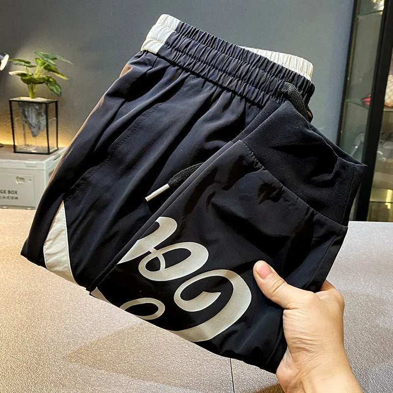 Black men's casual cropped trousers with ankle band made from ultra-thin ice silk and cotton.