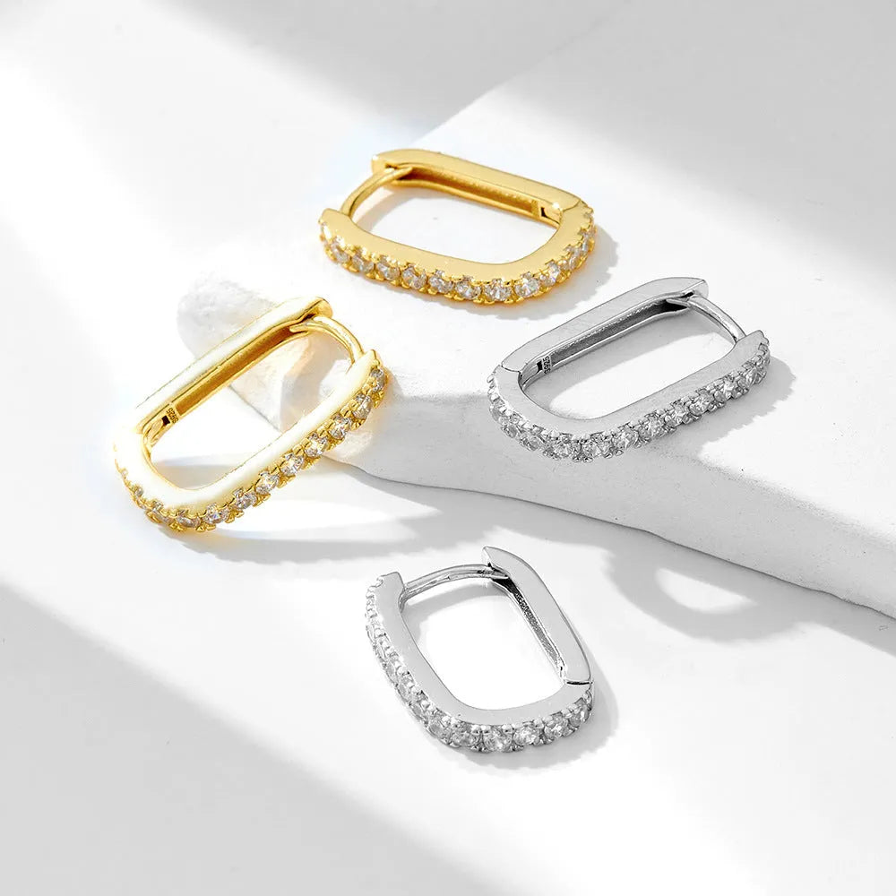 S925 sterling silver oval zircon earrings with ear clip fastening in geometric design