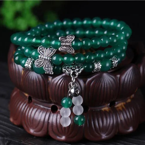 Natural green agate chain multi-layer bracelet with 6mm beads on a woman's wrist