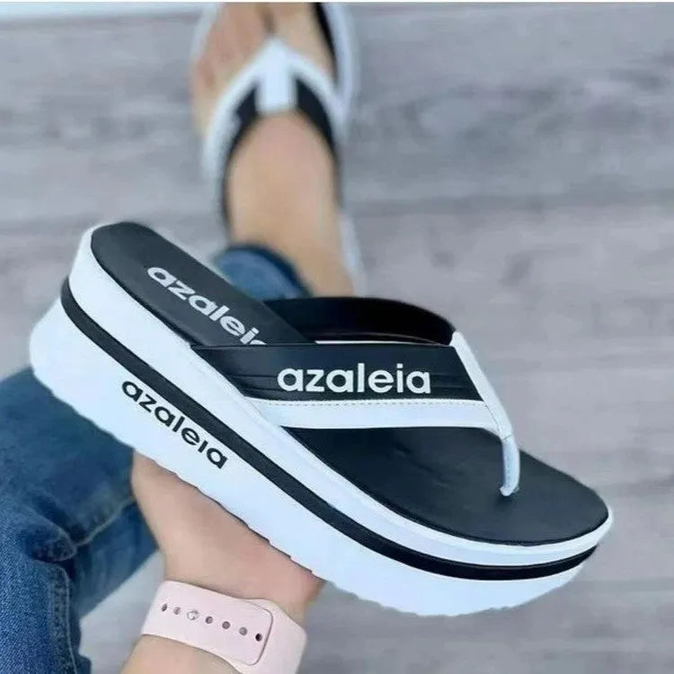 Women's solid colour platform slippers with herringbone toe strap in black, light green, and champagne options